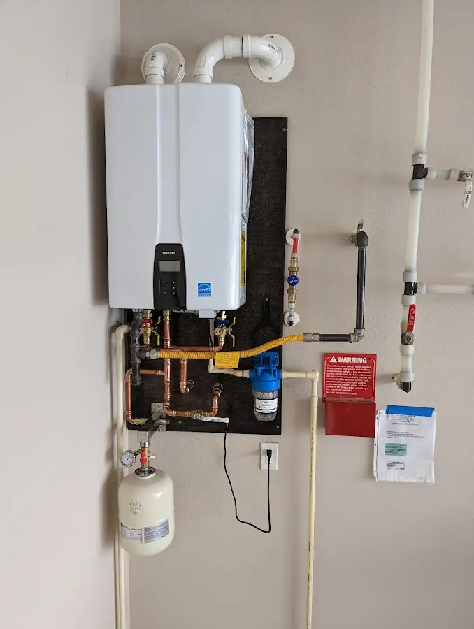 Professional plumber installing copper piping in a Miami home